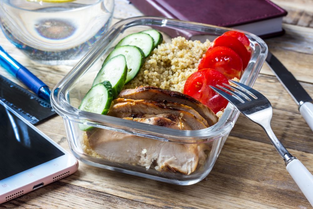 A Glass Container Filled With Food And A Fork — Home Nursing Services in Lake Cathie, NSW