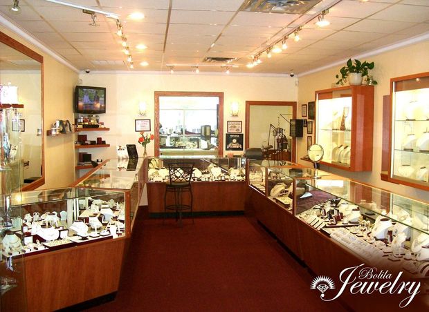 A jewelry box filled with lots of rings and bracelets.