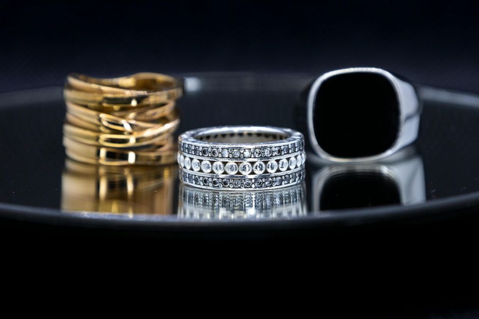 A jewelry box filled with lots of rings and bracelets.