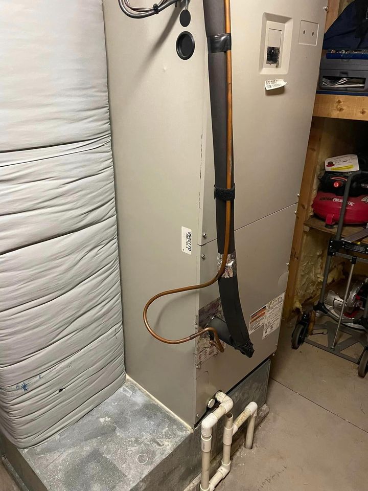 A room with a heater and a vacuum cleaner in it.
