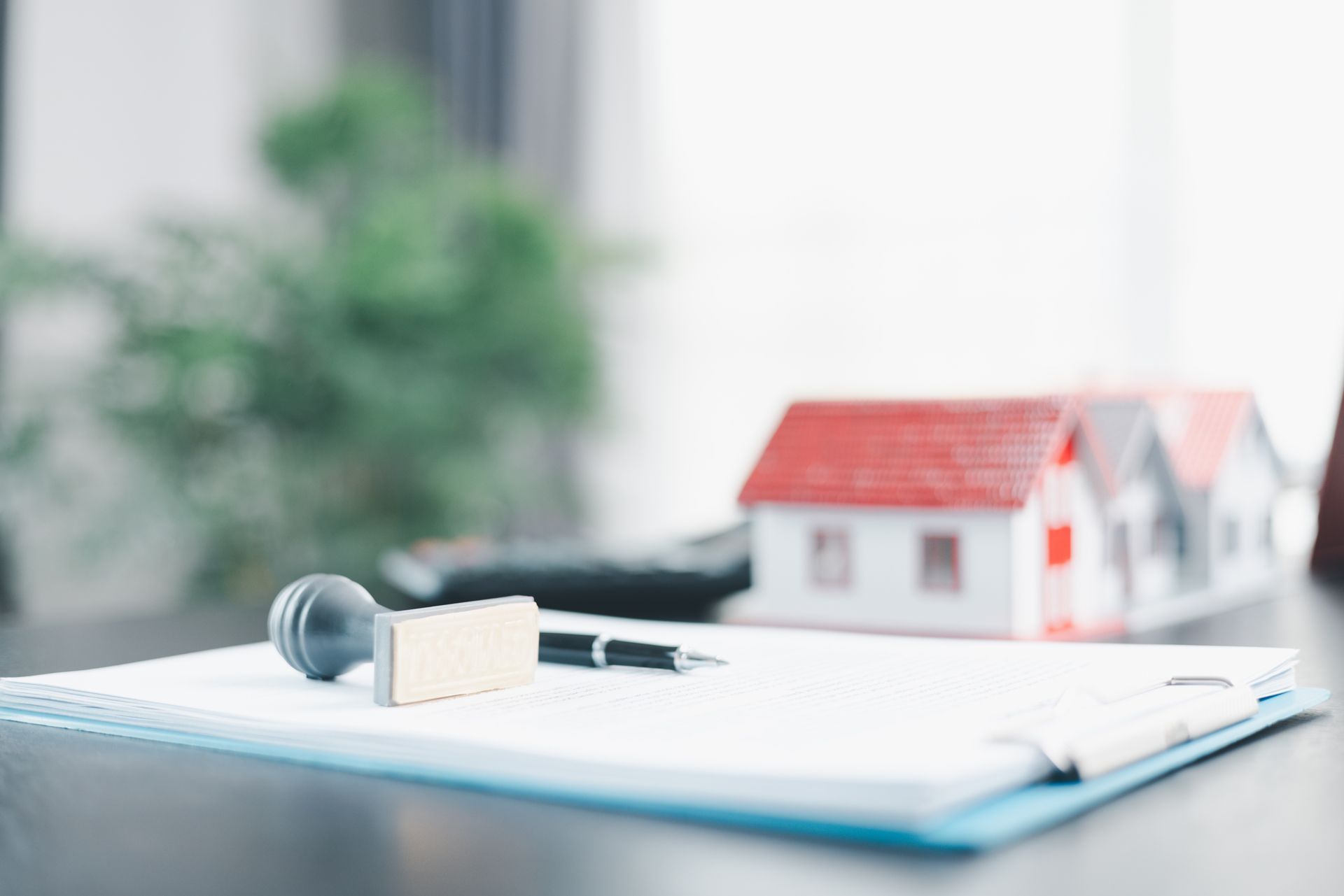 Real estate closing documents with a stamp
