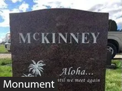 McKinney monument with engraved palm tree and the words “Aloha… we’ll meet again.”