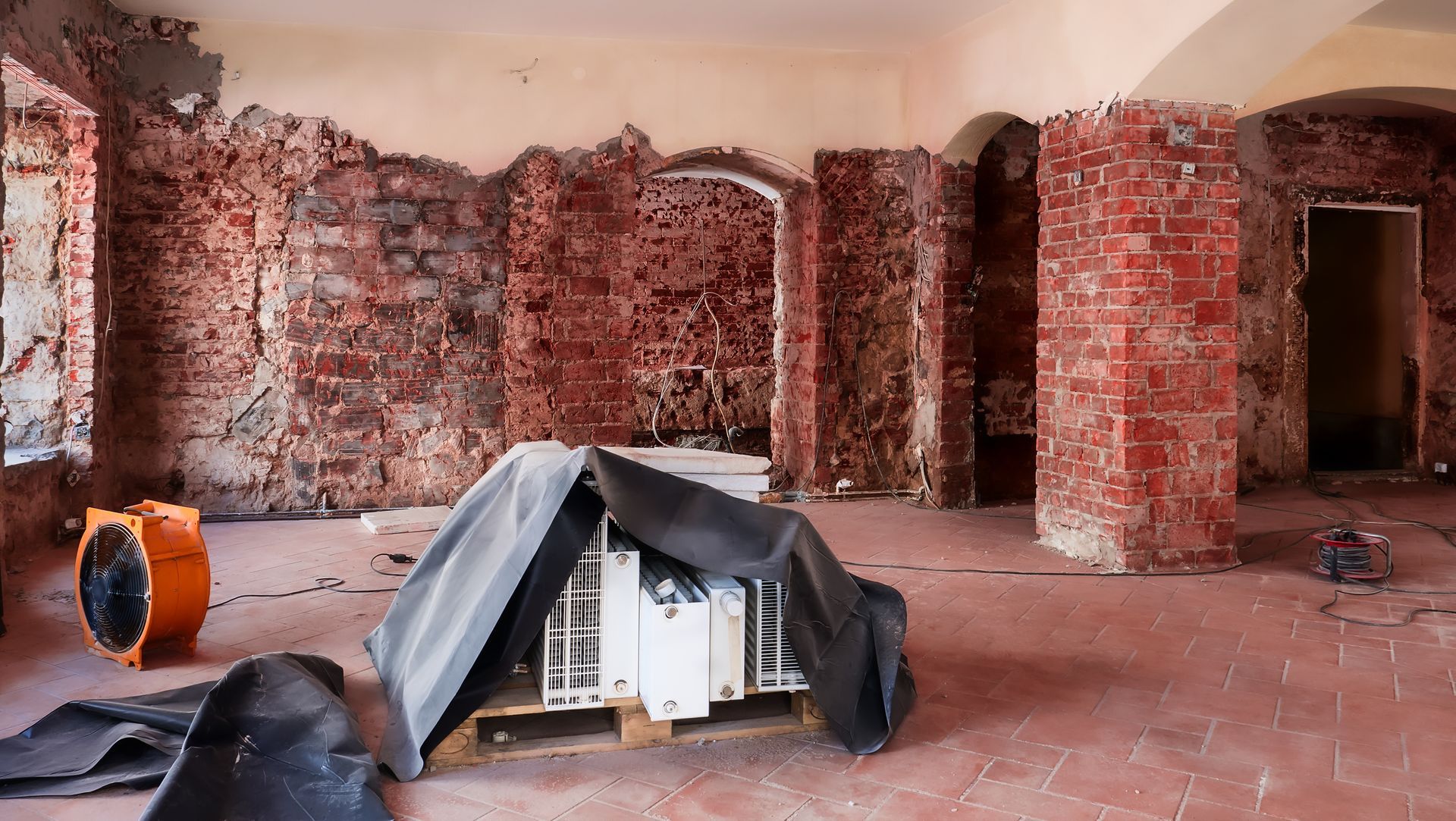 Professional drying equipment removing moisture from a water-damaged room
