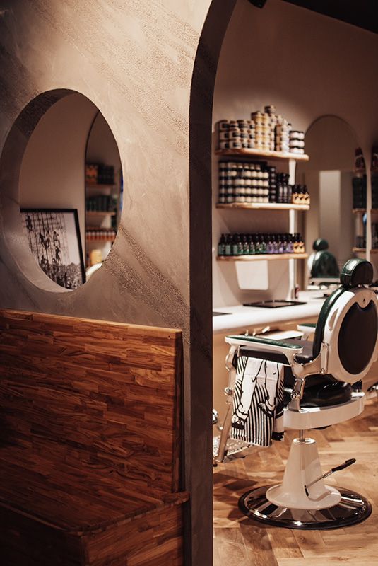 A Barber Shop With a Barber Chair and a Wooden Bench — Barber Bros & Co - Southport in Southport, QLD