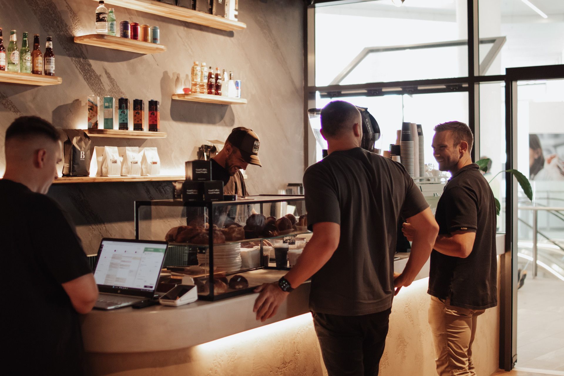 Men Ordering Coffee In Barber Shop — Barber Bros & Co - Southport in Southport, QLD