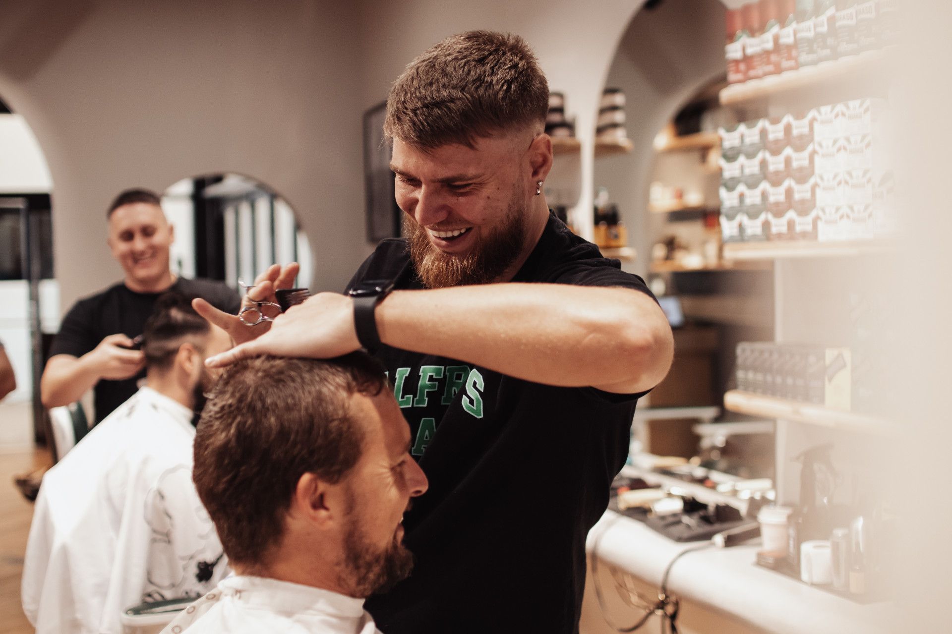 A Barber Shaving a Man's Beard with Electric Shaver — Barber Bros & Co - Southport in Southport, QLD