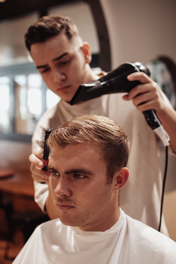 Barber Blow Drying Men's Hair— Barber Bros & Co - Southport in Southport, QLD