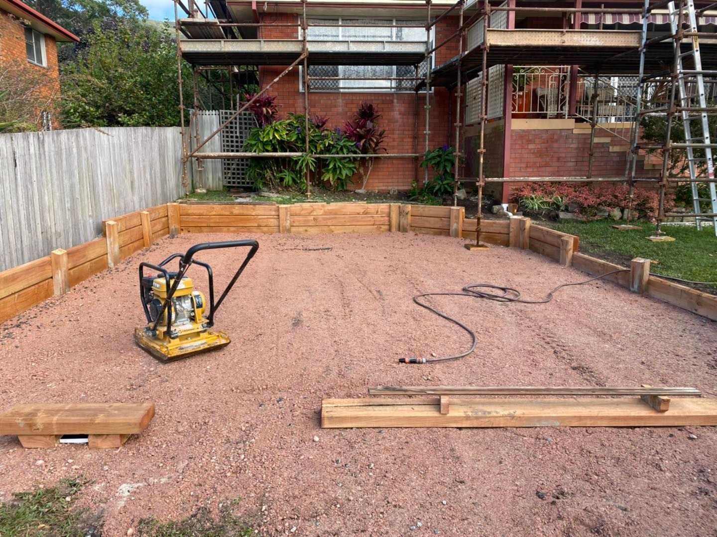 A Concrete Pad Is Being Built In Front Of A House — Red Shed Hire In Wauchope, NSW