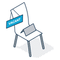 Blue vacant sign on an empty chair with a laptop, indicating an available seat