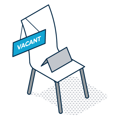 Blue vacant sign on an empty chair with a laptop, indicating an available seat