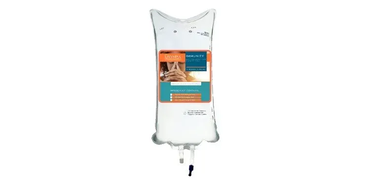 White hanging bag with an orange-and-teal label, likely a fertilizer or plant care product.