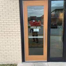 Single wood door with side light