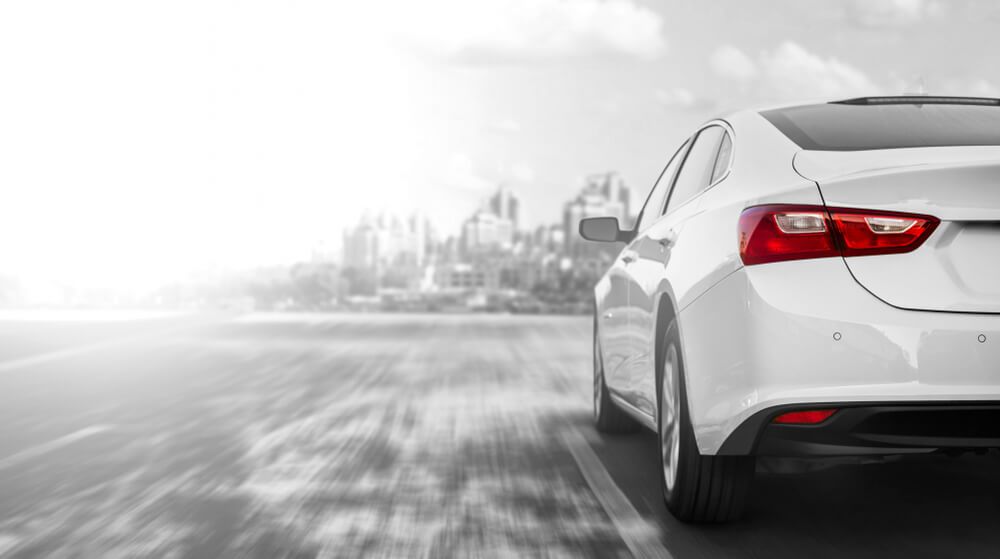 White Car Travelling on a Highway — Shepparton Radiators & Windscreens in Shepparton, VIC