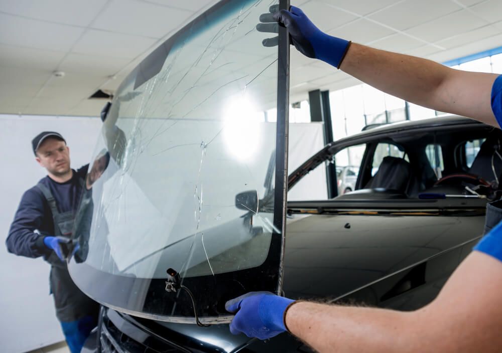 Worker Remove Broken Car Windscreen — Shepparton Radiators & Windscreens in Echuca, VIC