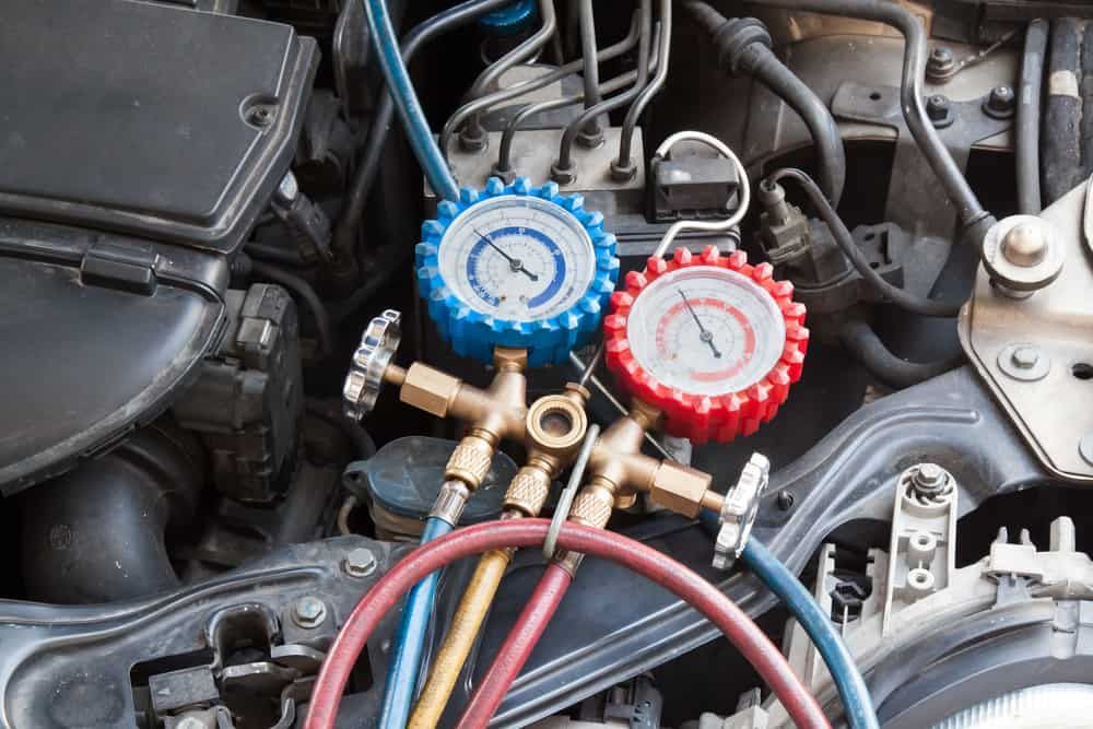 A Close Up of a Car Engine With Two Gauges Attached to It — Shepparton Radiators & Windscreens in Echuca, VIC