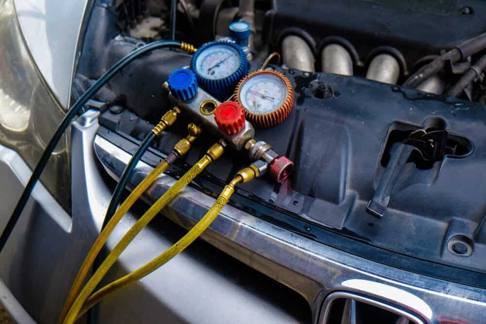 A Close Up of a Car Engine With Gauges Attached to It — Shepparton Radiators & Windscreens in Yarrawonga, VIC