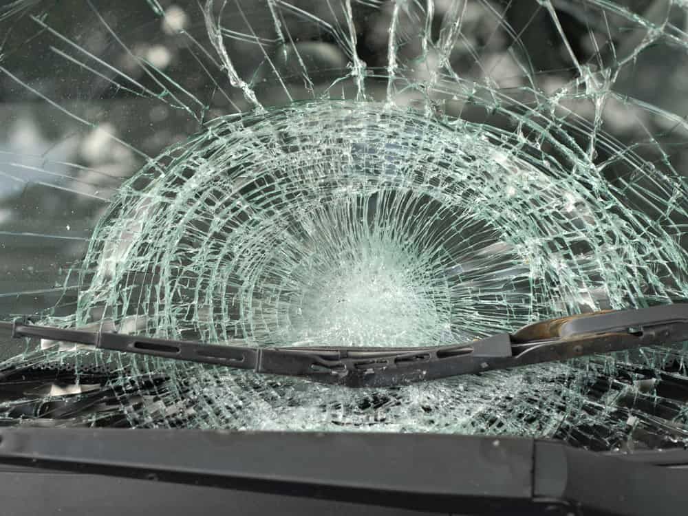 A Close Up of a Broken Windshield With a Wiper Blade — Shepparton Radiators & Windscreens in Cobram, VIC
