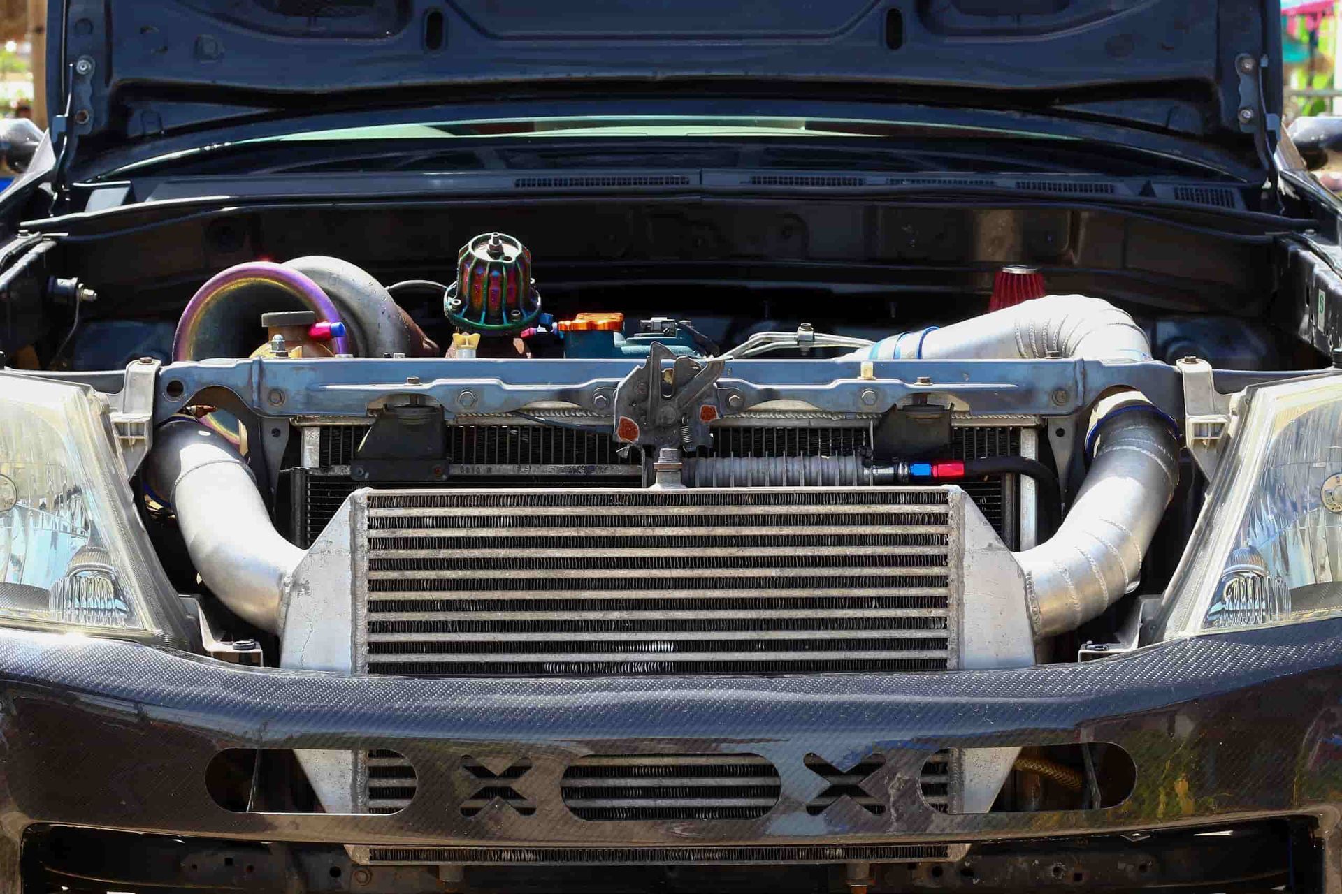 A Close Up of a Car Engine With the Hood Open — Shepparton Radiators & Windscreens in Yarrawonga, VIC