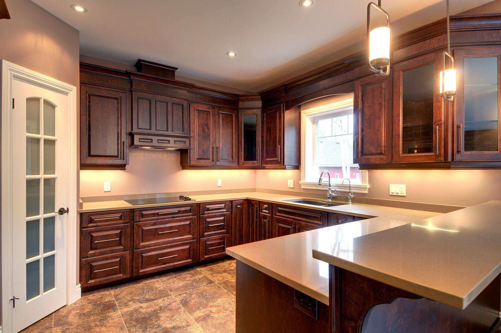 A kitchen with wooden cabinets and granite counter tops