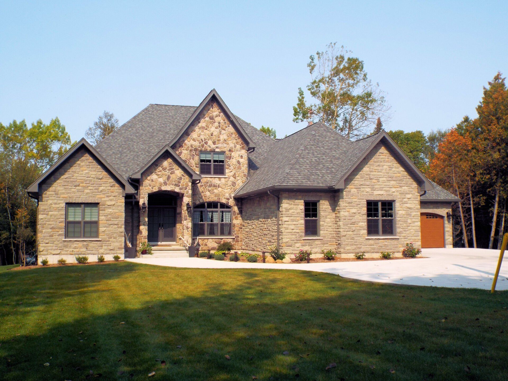 A large brick house with a gray roof