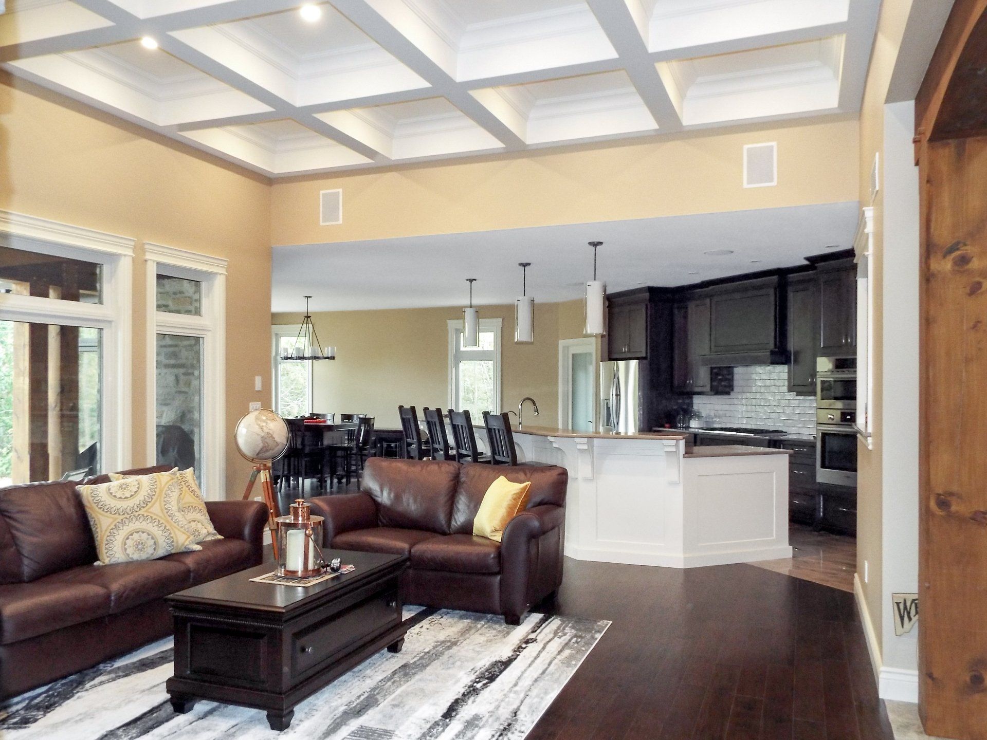 A living room with a couch , coffee table , and rug.