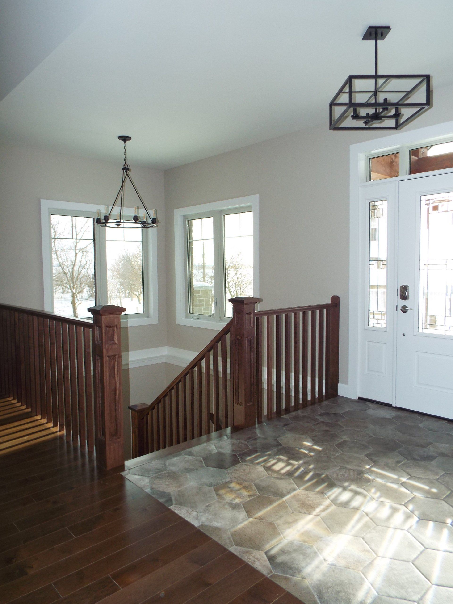 There is a staircase leading up to the second floor of a house.