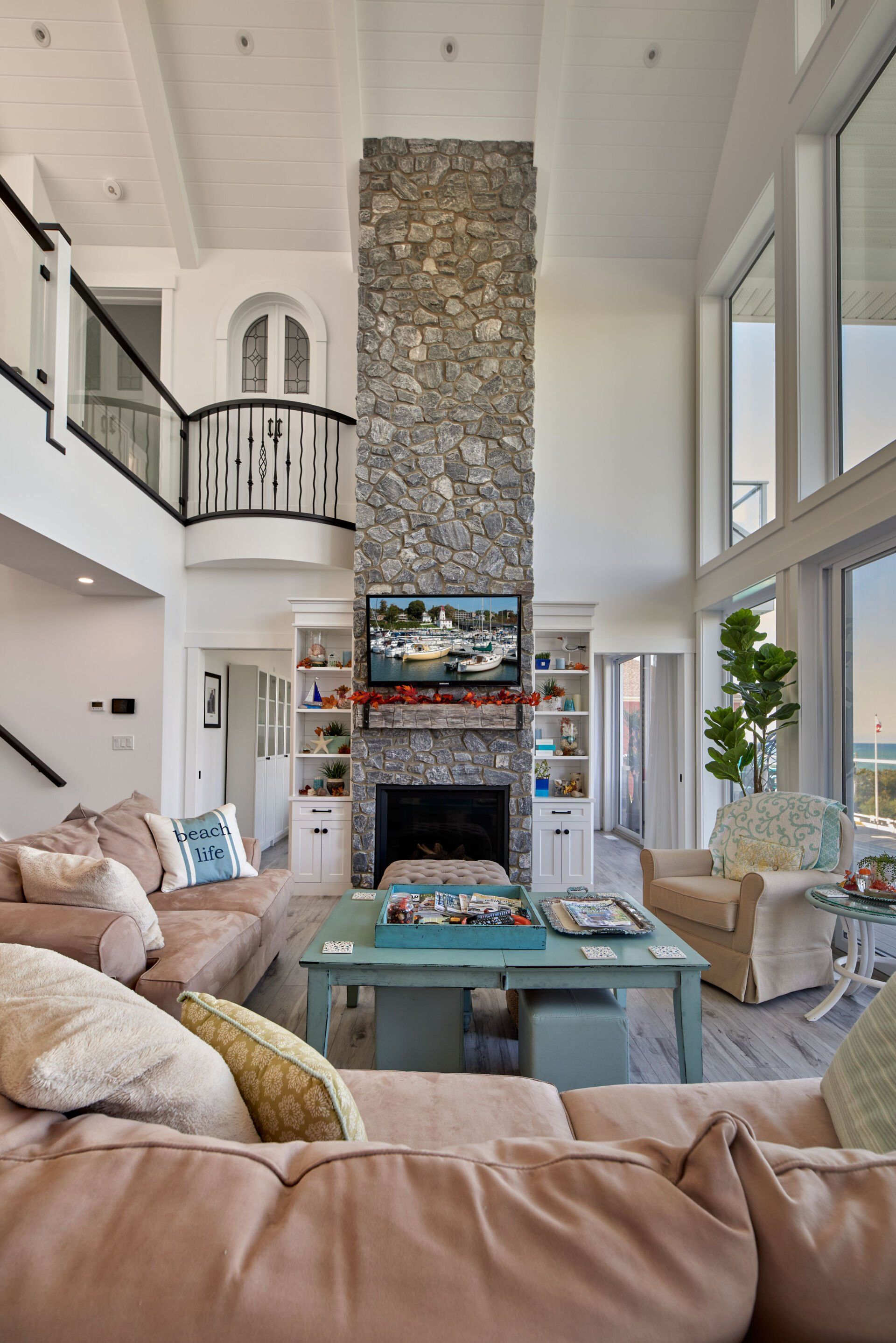 A living room with a fireplace and a flat screen tv