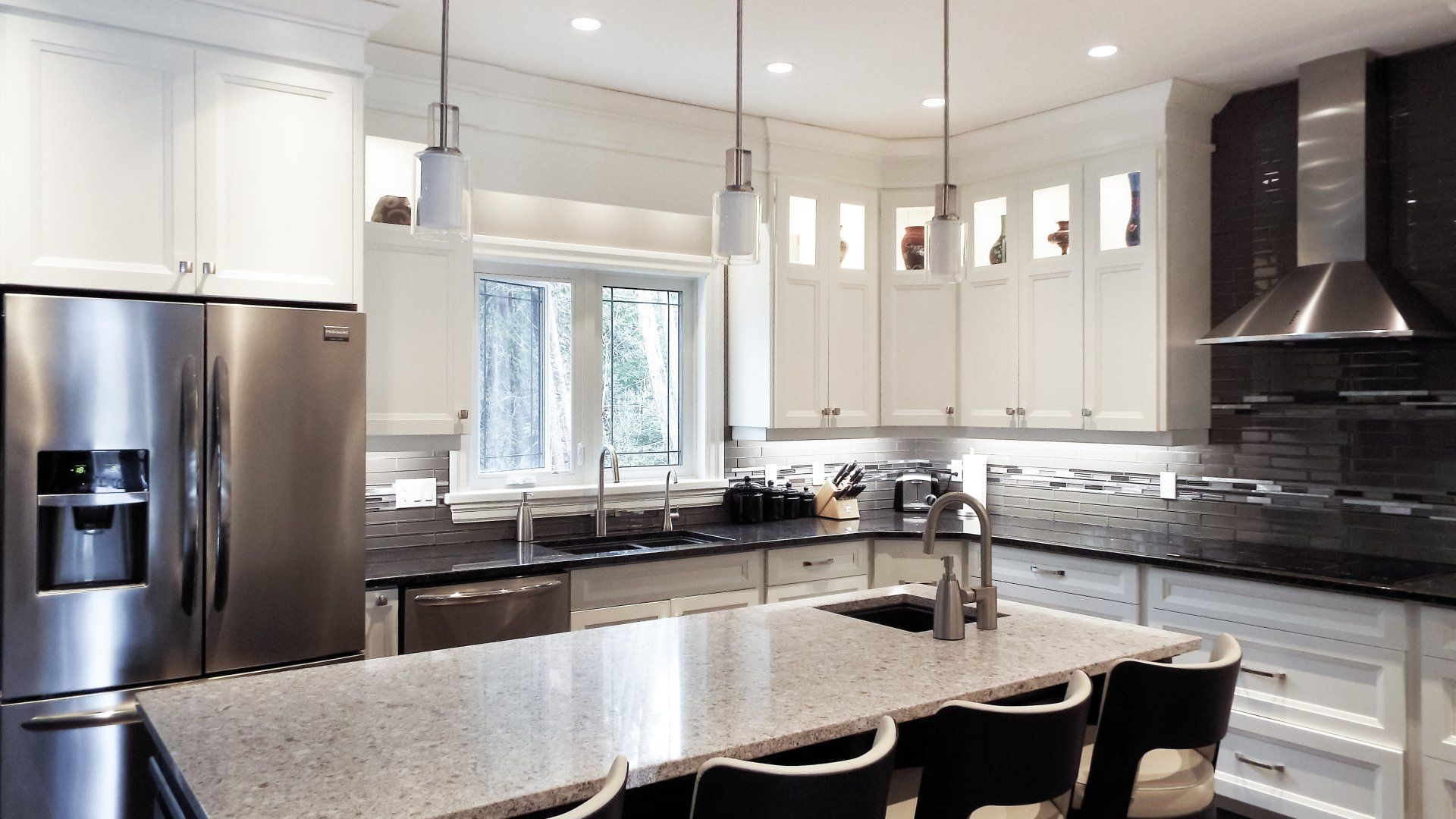 A kitchen with stainless steel appliances and granite counter tops