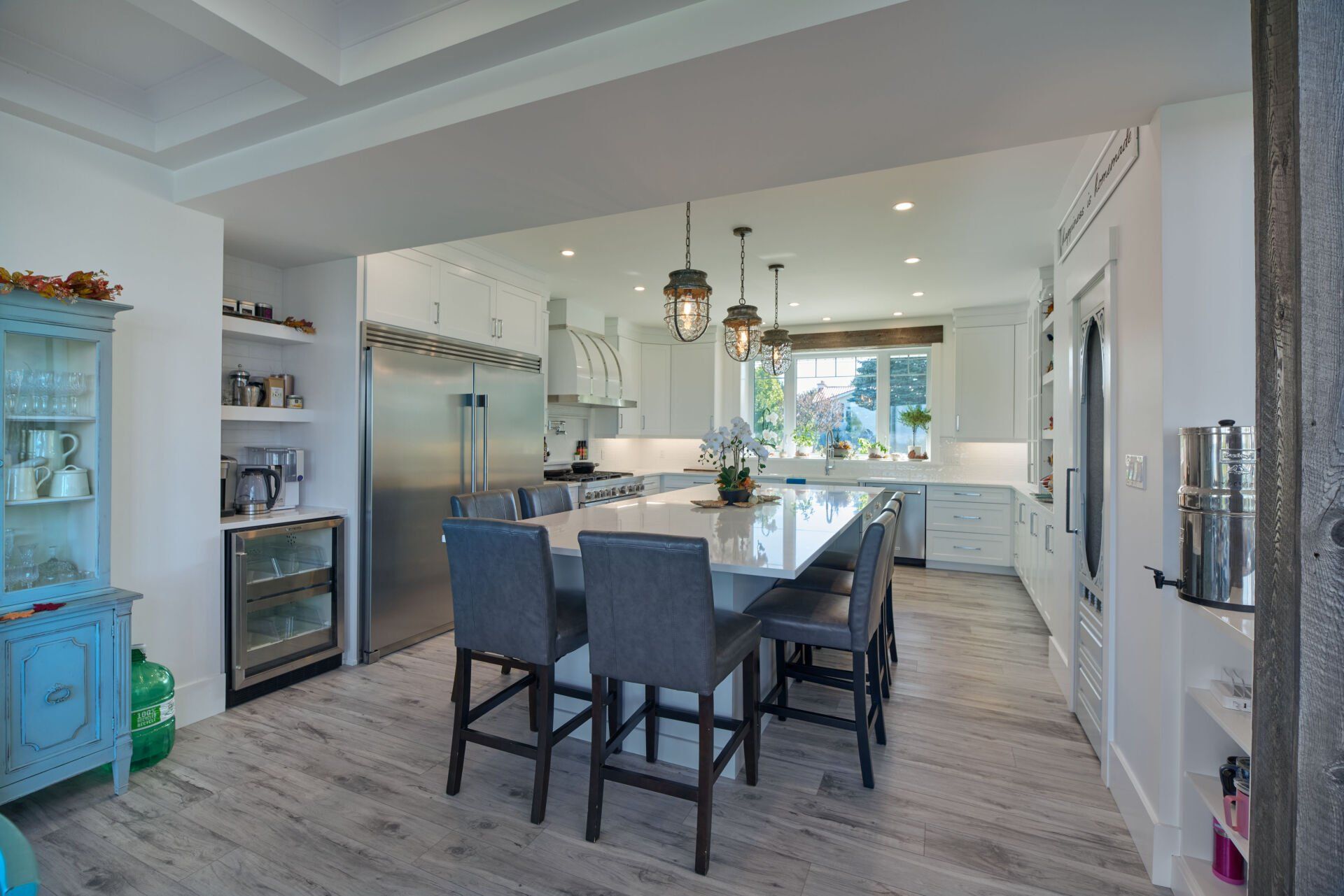 There is a large island in the middle of the kitchen.