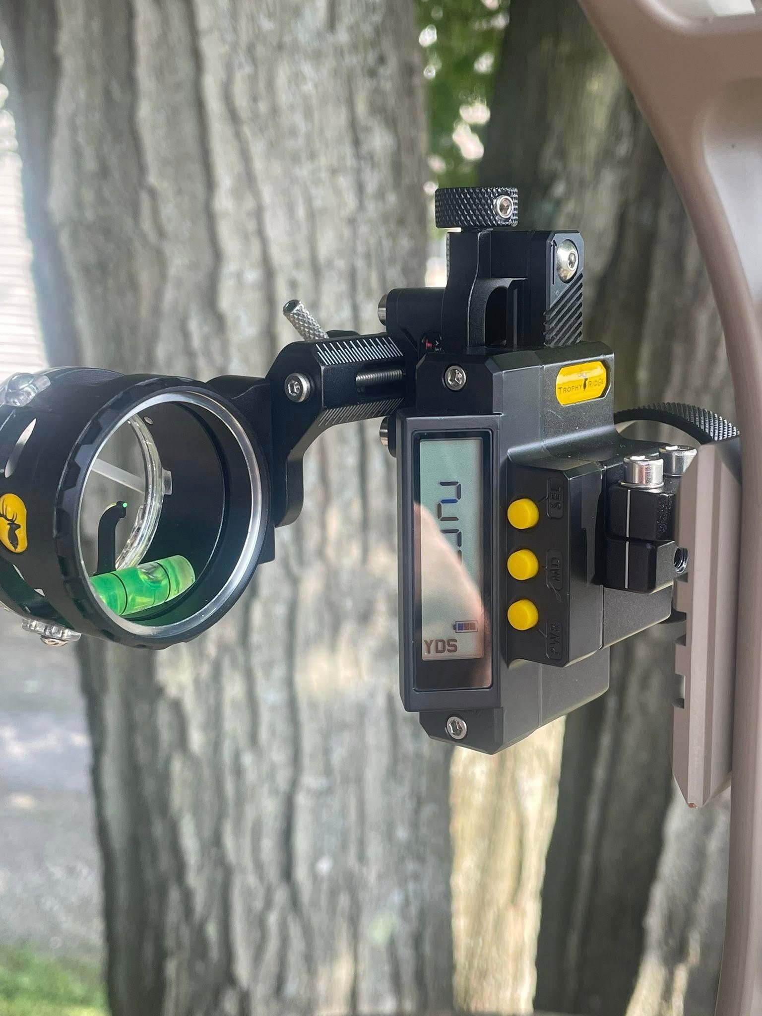 Black archery sight with digital display showing 