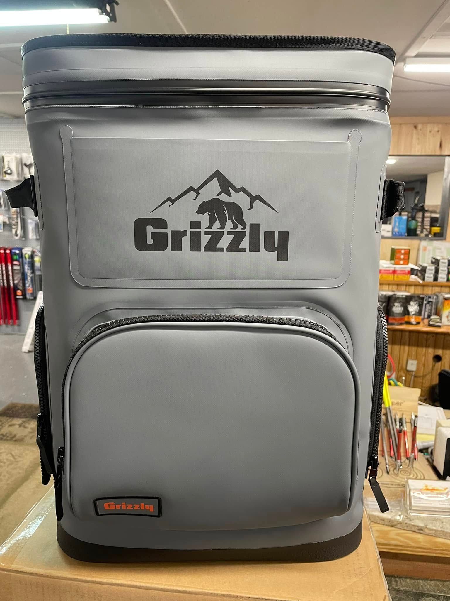 Gray Grizzly cooler with bear logo on display in a store.