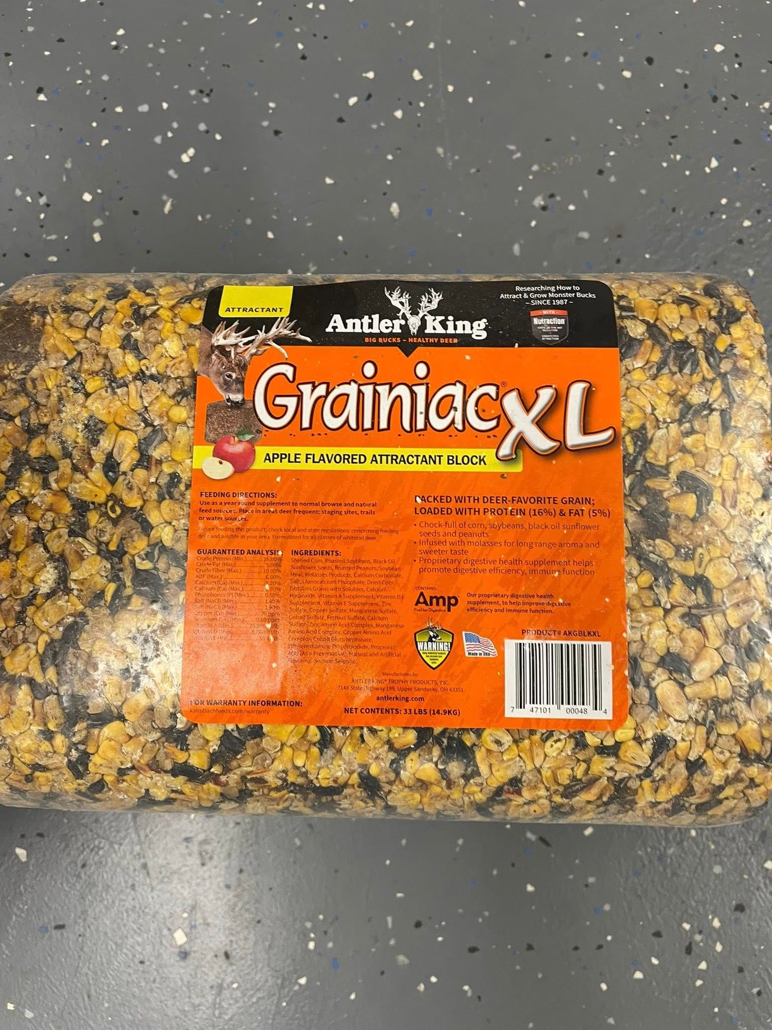 Bag of Ani-Logics Grainiac XL horse feed on a speckled floor.