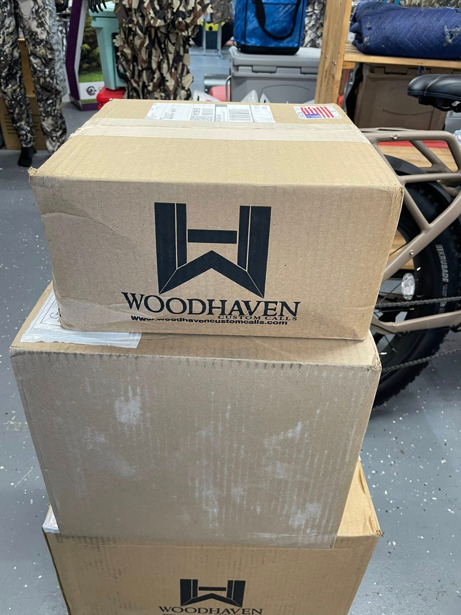 Three cardboard boxes stacked, each with 