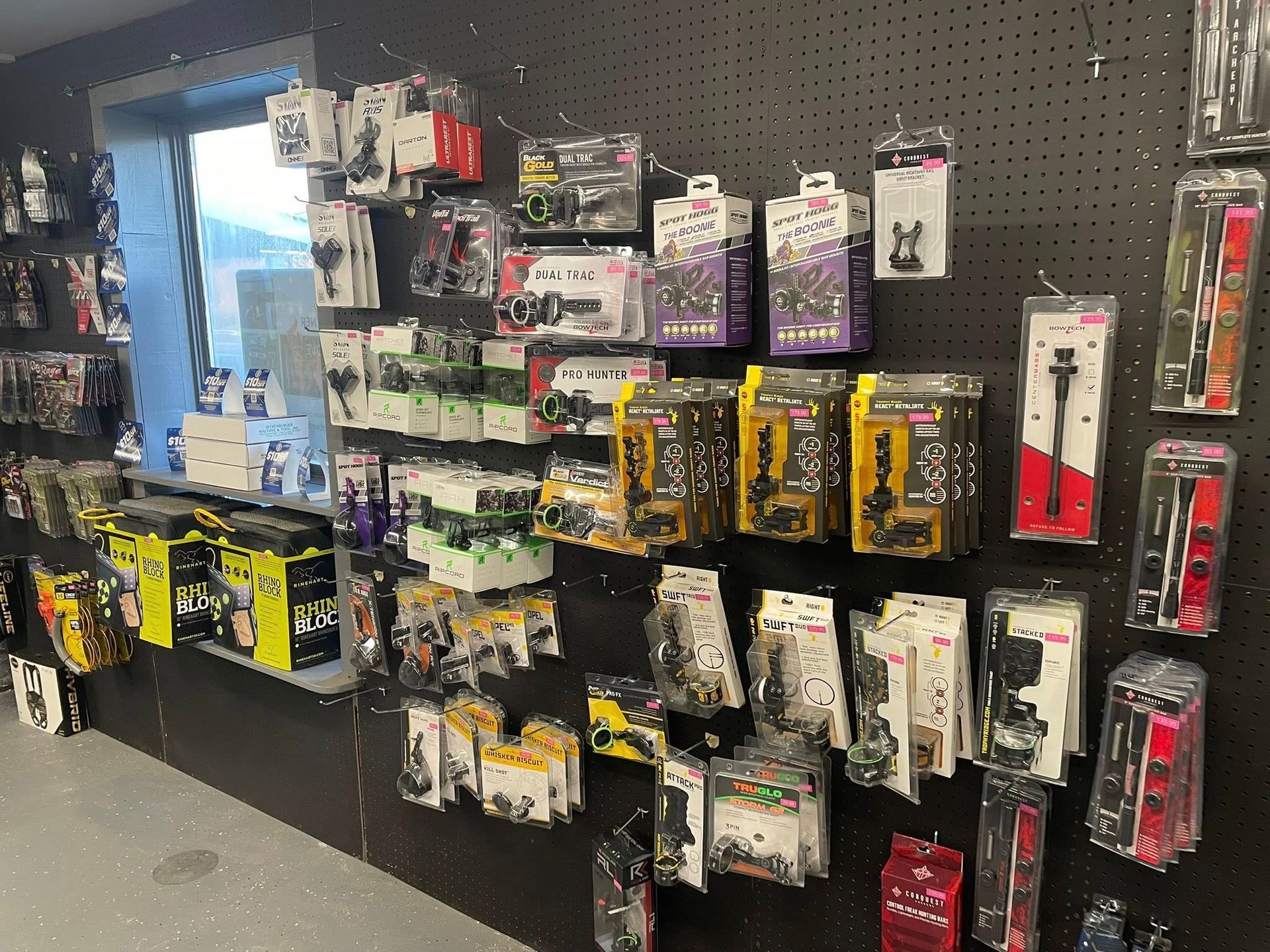 Shelves displaying packaged merchandise in a store, with various colors and products visible.