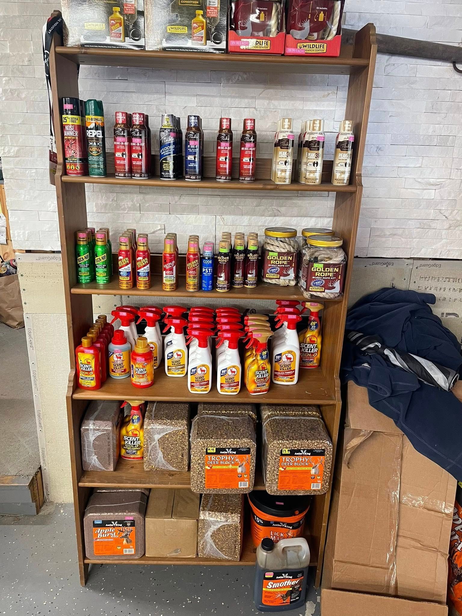 Wooden shelf filled with various bottles, jars, and bags of product.