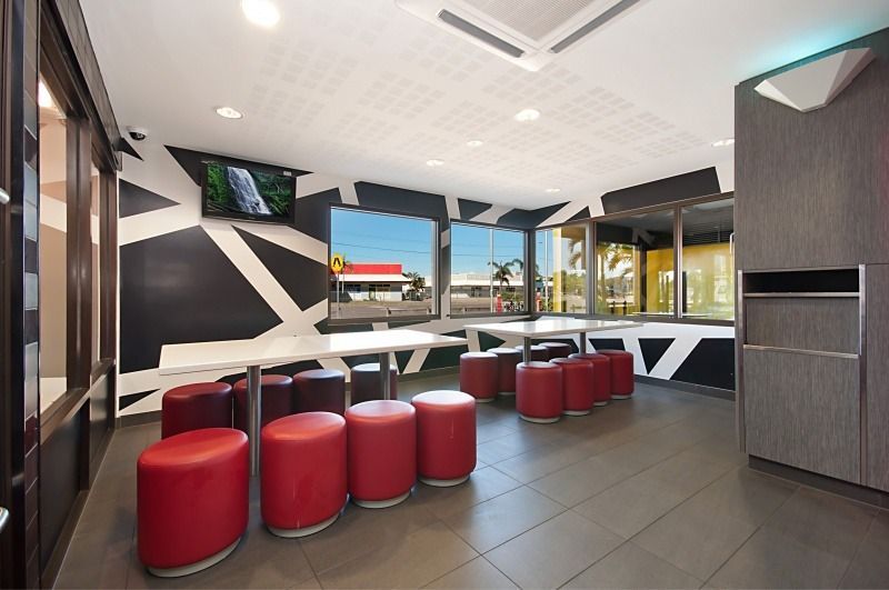 A Room With Red Chairs and Tables in It — Nick Favot Painting in Bohle, QLD