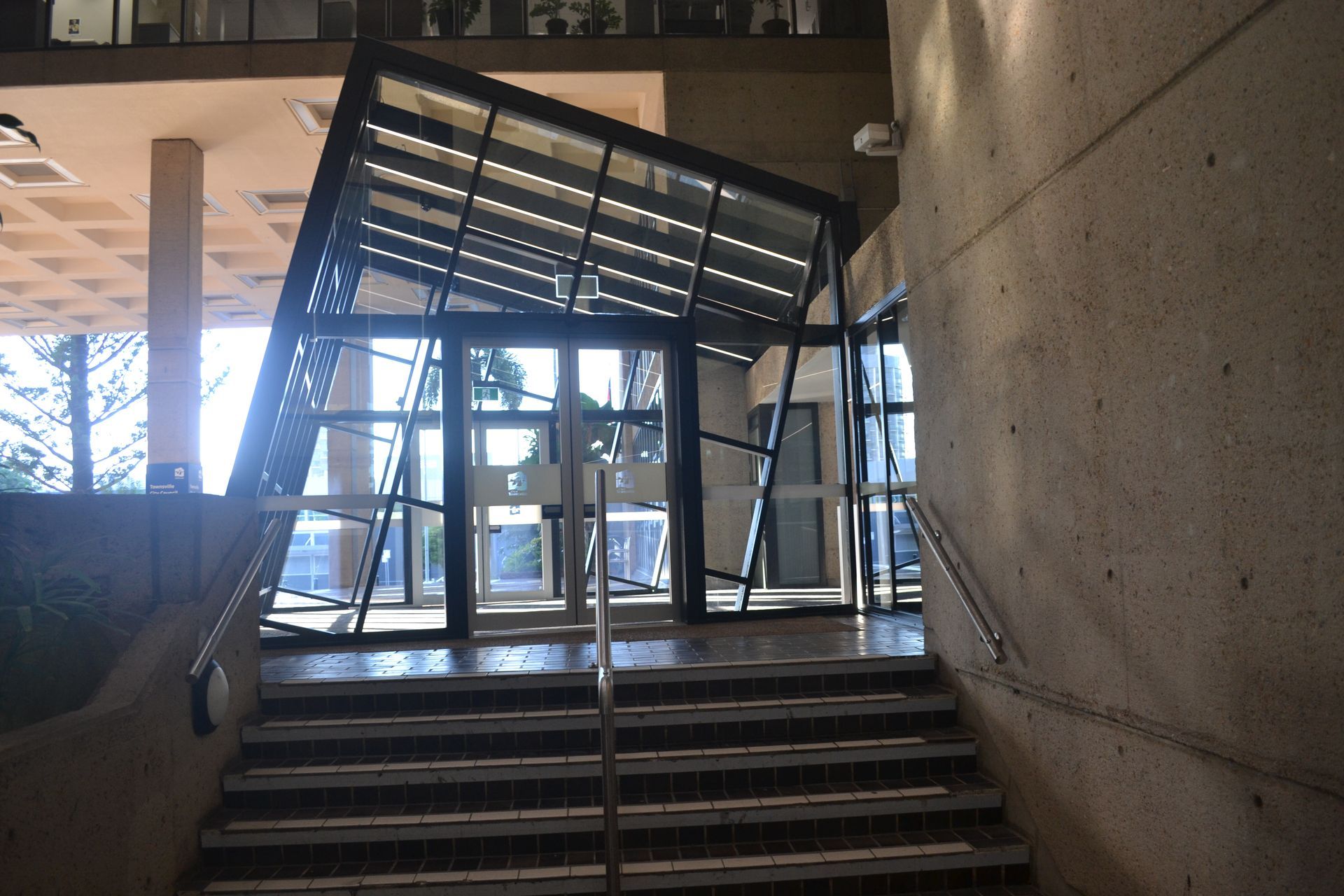 Tilted Glass Entrance Structure With Dark Frames — Nick Favot Painting In Bohle, QLD