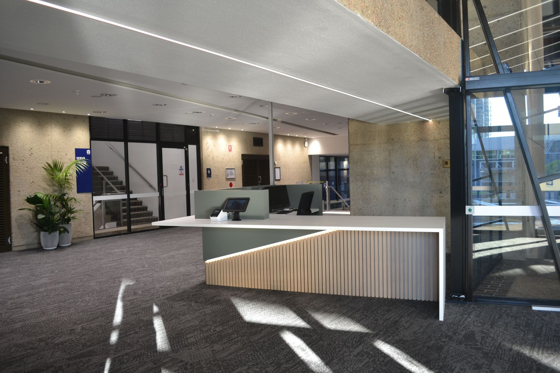 Modern Office Lobby With a White Reception Desk — Nick Favot Painting In Bohle, QLD