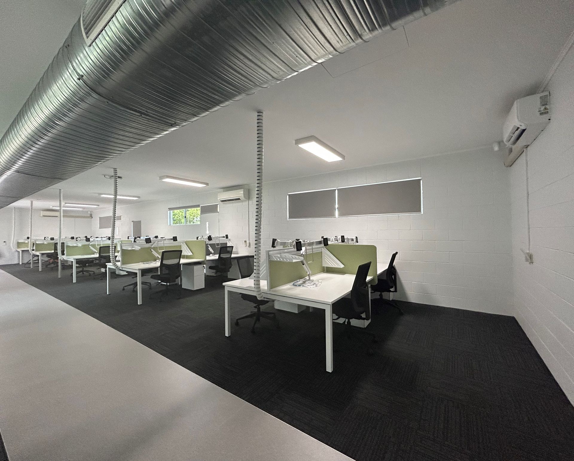 Rows of Empty Workstations Featuring Green Dividers — Nick Favot Painting In Bohle, QLD