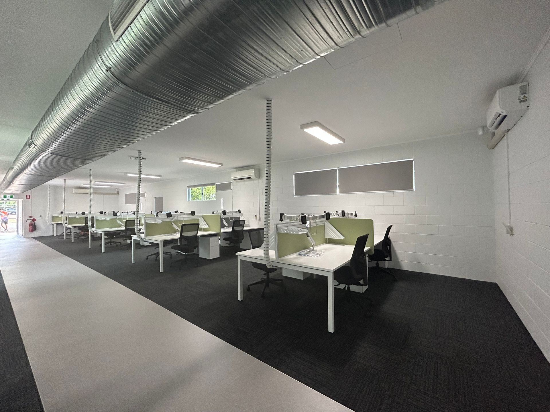 Modern Office Space With White Desks and Green Dividers — Nick Favot Painting In Bohle, QLD