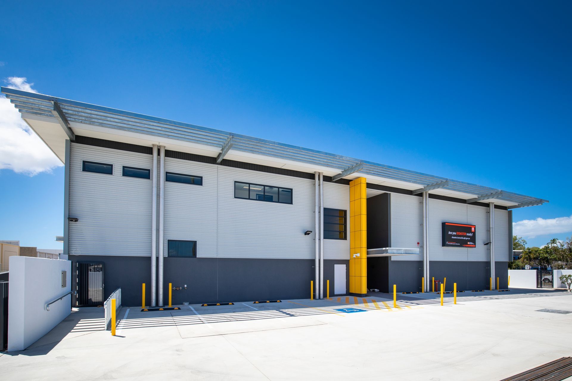 Modern Industrial Building With a Flat Roof — Nick Favot Painting In Bohle, QLD