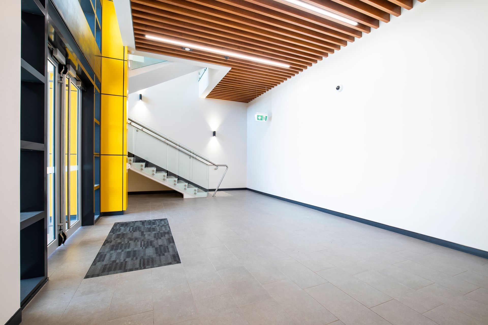 Spacious Modern Lobby With a Glass Staircase — Nick Favot Painting In Bohle, QLD