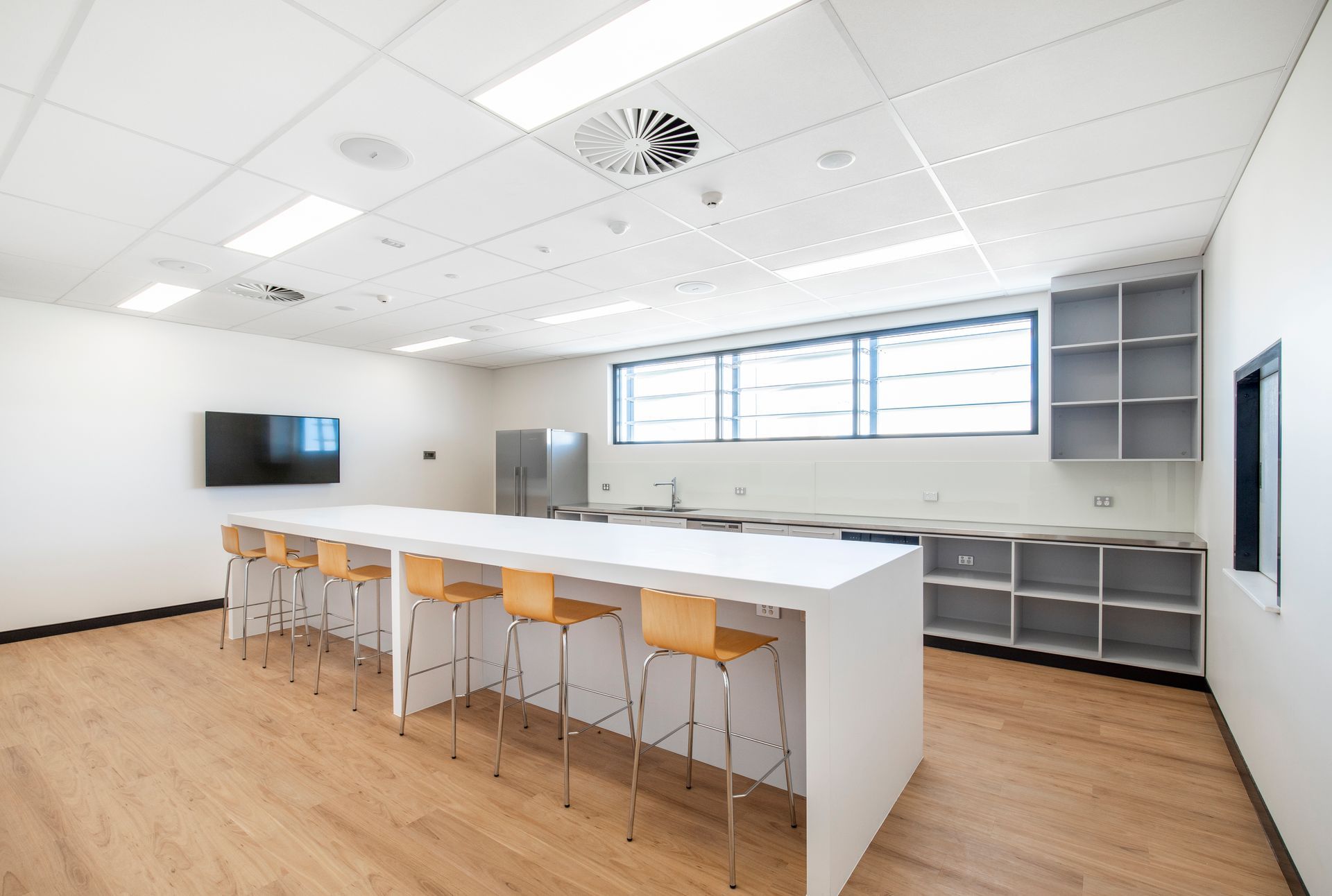 Modern Kitchen With a Long White Island — Nick Favot Painting In Bohle, QLD