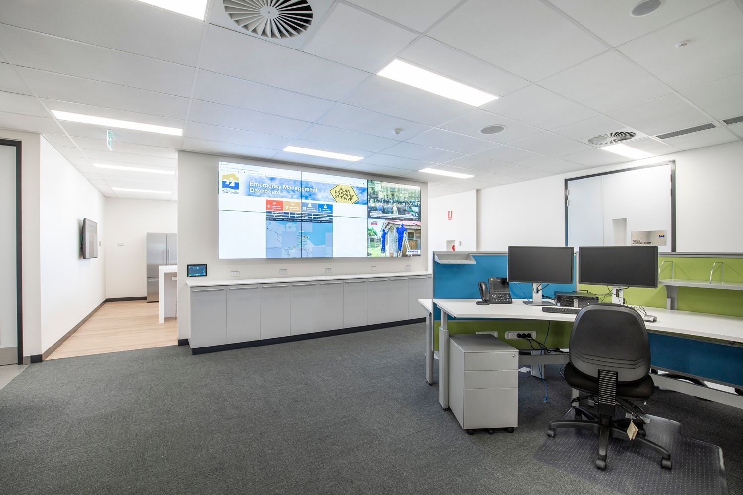 Modern Room With a Large Screen Displaying Emergency Management Data — Nick Favot Painting In Bohle, QLD