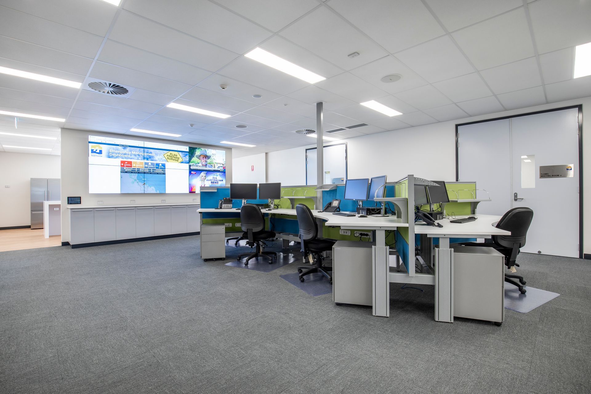 A Modern Office Space With Multiple Desks, Computers, and Chairs — Nick Favot Painting In Bohle, QLD