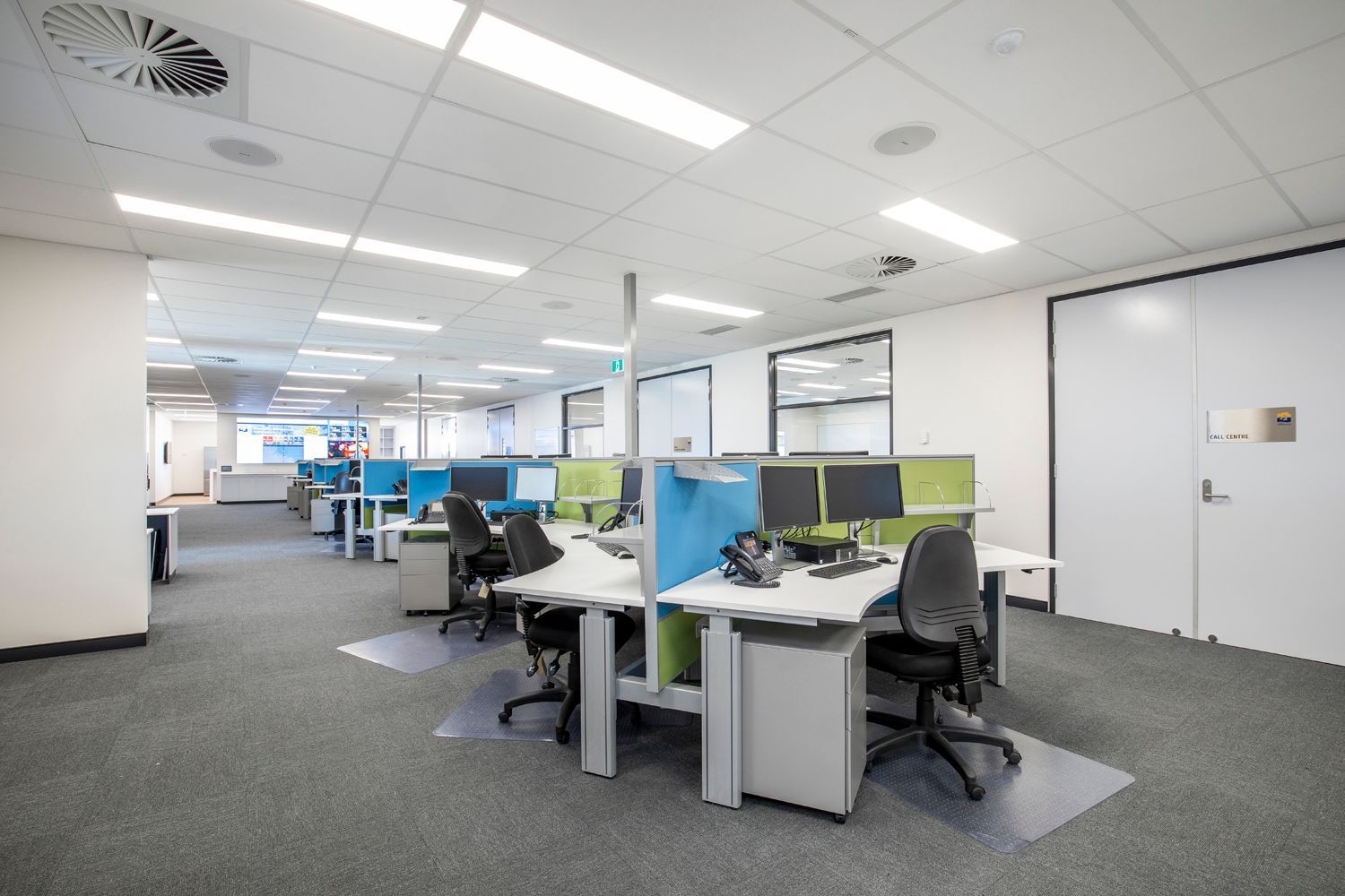 Workstations Featuring Black Chairs, Multiple Monitors, and Telephones — Nick Favot Painting In Bohle, QLD