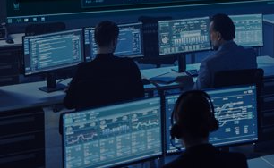 Three gentlemen watching multiple screens for fire detection  and security