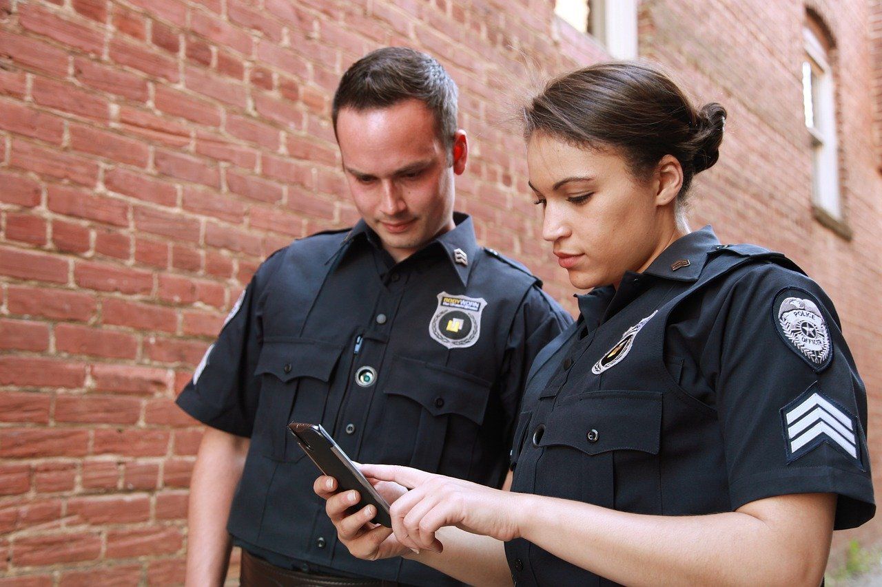 security guards using security camera app to monitor threats