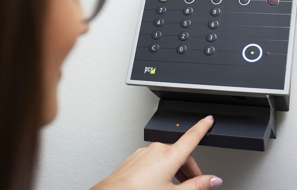 woman using a biometric scanner