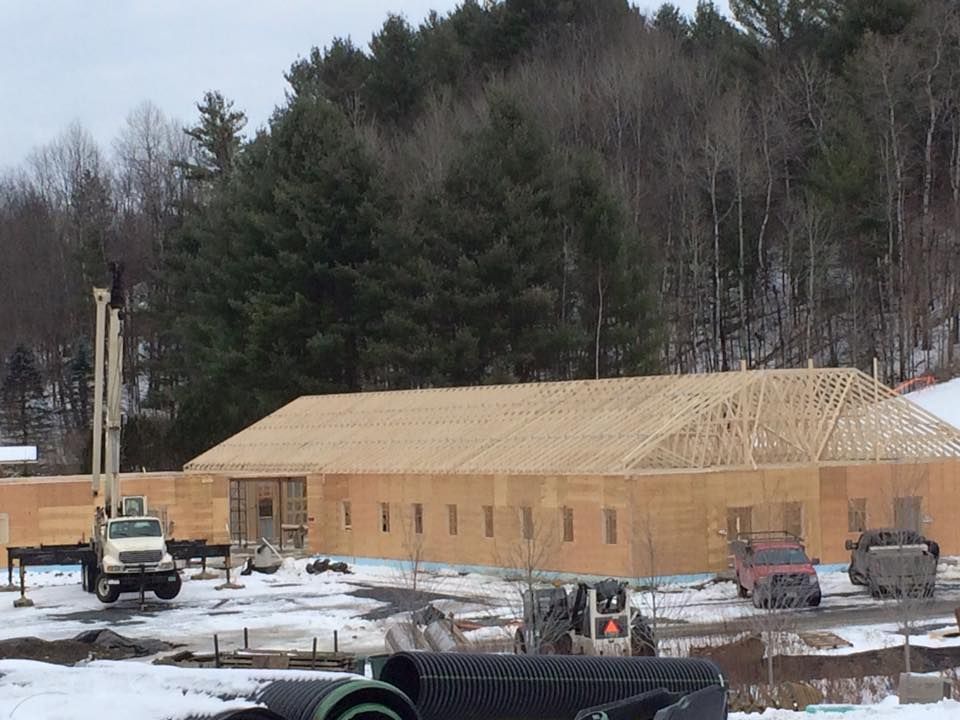 A rented crane sits on site in Vermont